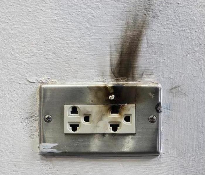 electrical outlet with soot