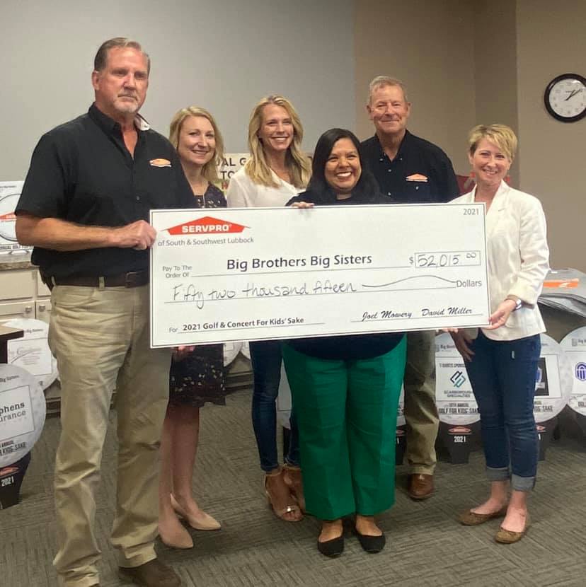 SERVPRO of Southwest Lubbock presents a check totaling $52,015 to Big Brothers and Big Sisters of Lubbock.